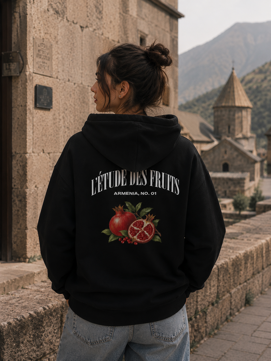 Woman wearing L'Étude des Fruits pomegranate pullover hoodie
