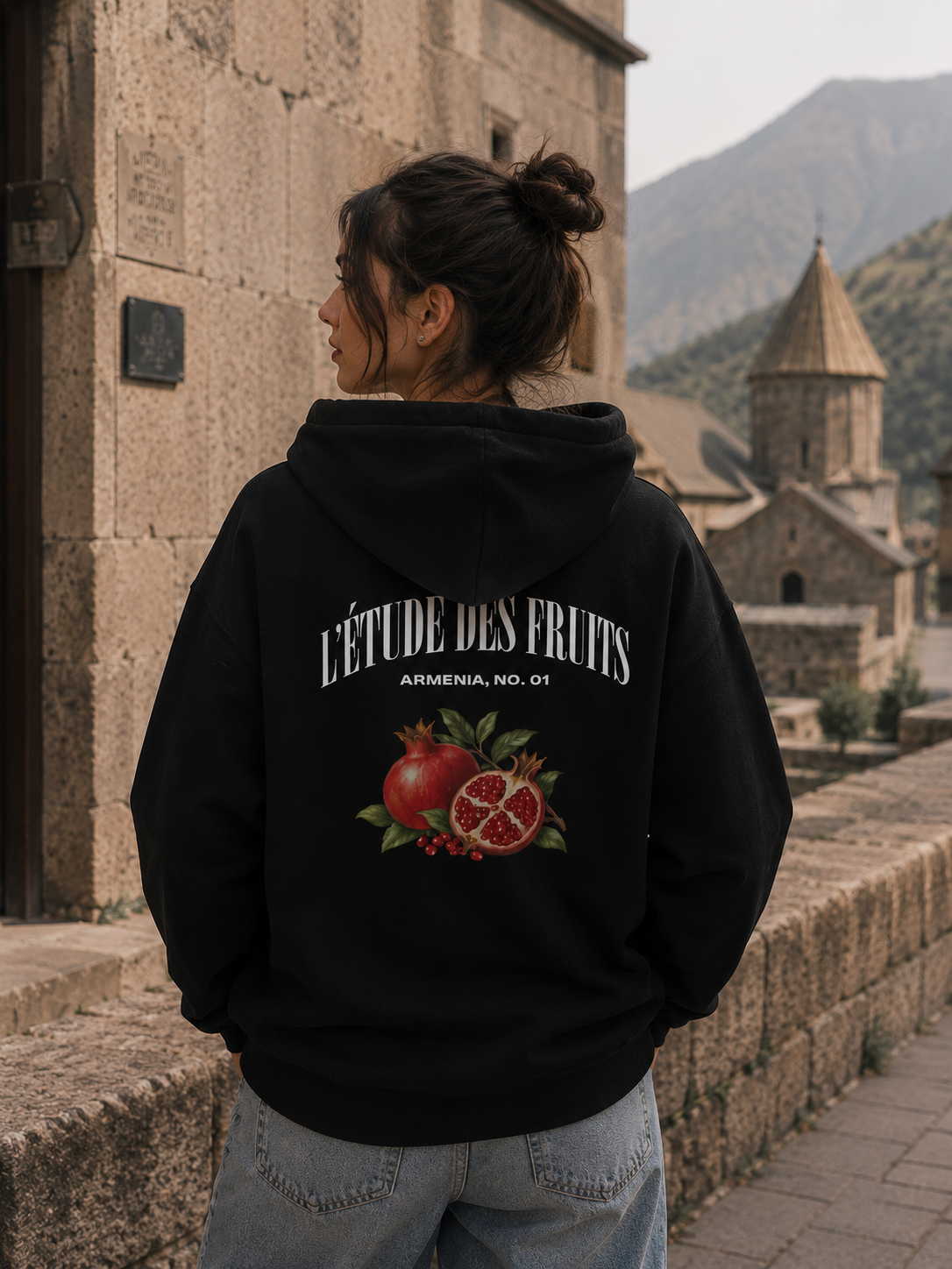 Woman wearing L'Étude des Fruits pomegranate pullover hoodie
