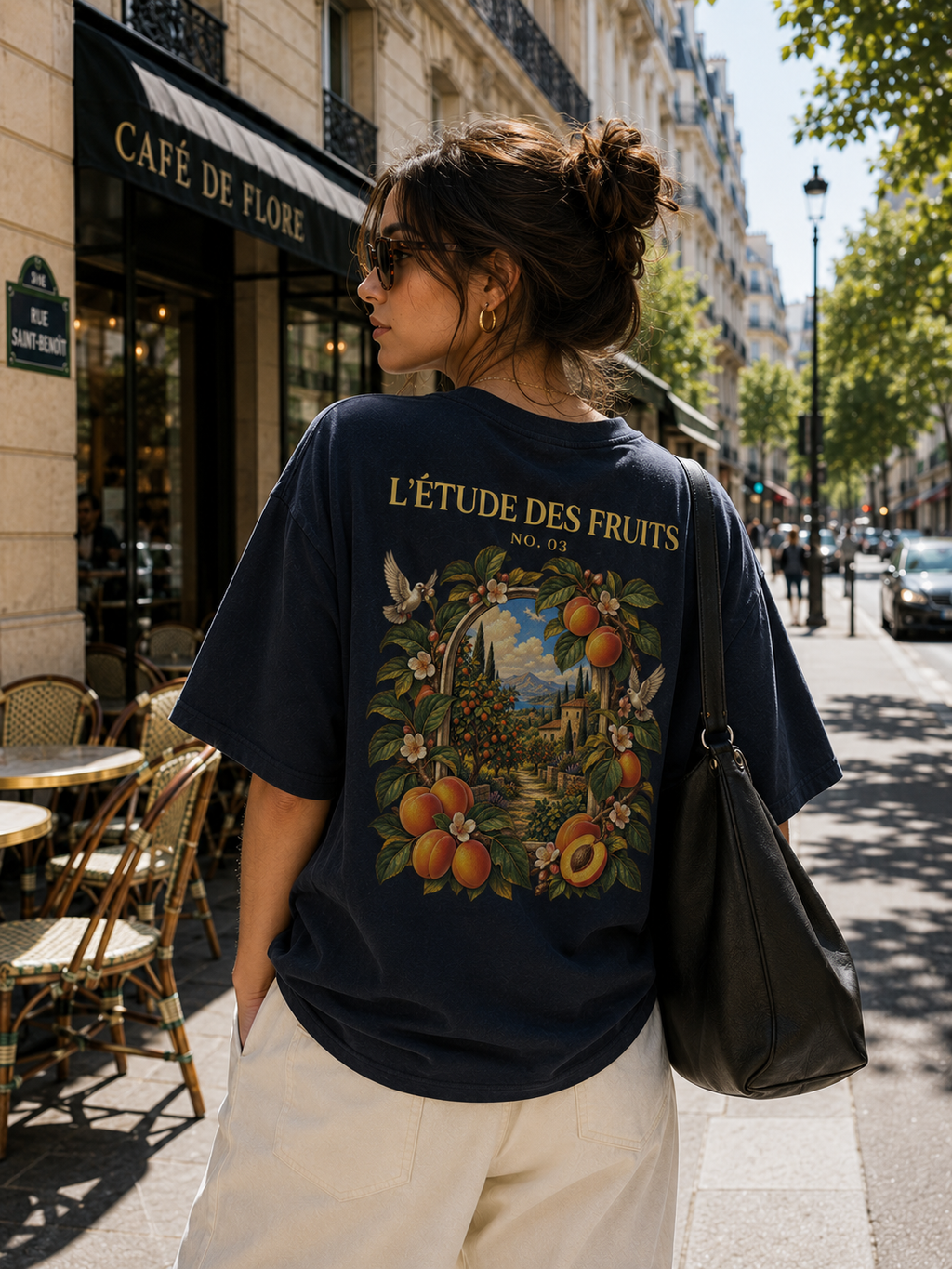 Woman wearing L'Étude des Fruits Armenia No. 03 golden apricot back graphic heavyweight tee in navy