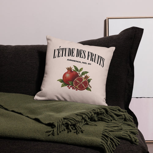 Detail of pomegranate botanical artwork on decorative pillow cover