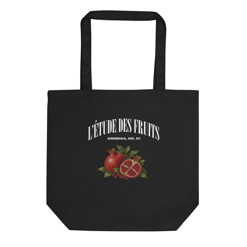 Product mockupDetail of pomegranate botanical artwork on black organic cotton tote bag