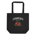 Product mockupDetail of pomegranate botanical artwork on black organic cotton tote bag