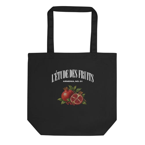 Product mockupDetail of pomegranate botanical artwork on black organic cotton tote bag