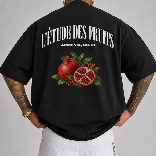 Detail shot of pomegranate artwork on black heavyweight tee